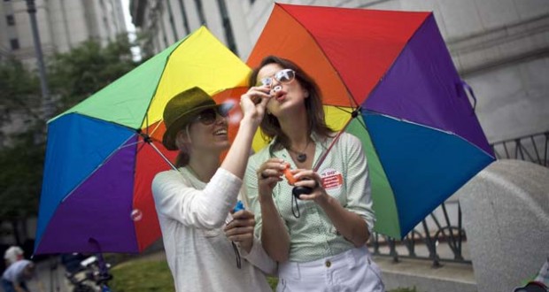 Yezbak and Priebe blow bubbles outside the Manhattan City Clerk's office